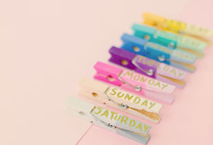 Coloured pegs with days of the week