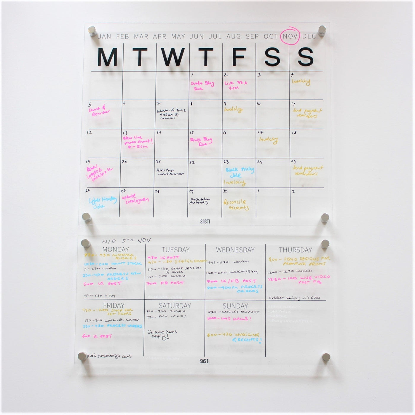 Siisti clear acrylic wall calendar and weekly planner displayed together
