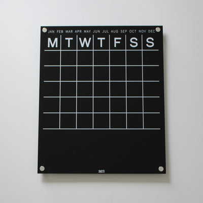 Black and white acrylic perpetual monthly wall calendar with notes